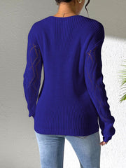 Dark blue acrylic knit sweater with openwork lace detail on sleeves.