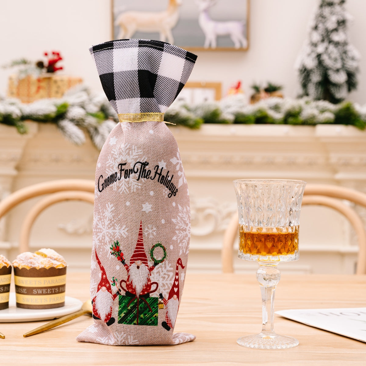 Gnome holiday wine bottle gift set with red and black buffalo check top and gnome and snowflake print.