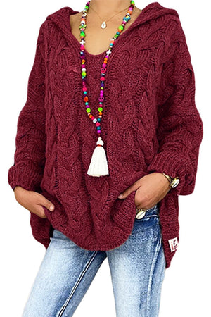 Burgundy cable knit hooded cocoon sweater with a v-neck and long sleeves.