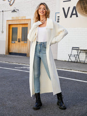 Longline knit collar cardigan in white with a relaxed fit, styled with jeans and boots.