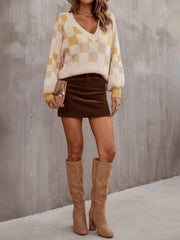 Geometric puff sleeve v-neck knit sweater in cream and light yellow checkerboard pattern, acrylic fabric.