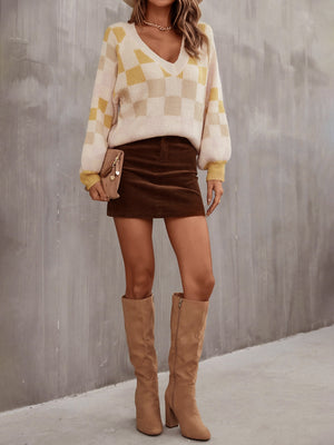 Geometric puff sleeve v-neck knit sweater in cream and light yellow checkerboard pattern, acrylic fabric.