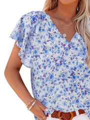 Floral flutter sleeve v-neck blouse in blue and purple floral print polyester.