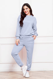Light blue relaxed fit loungewear set with crew neck sweatshirt and drawstring pants.