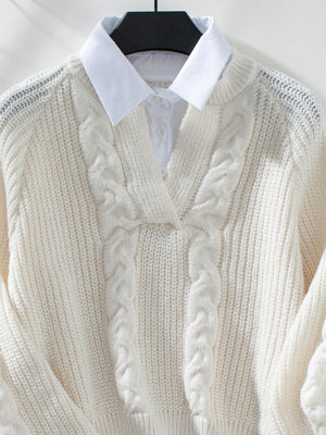 Cream cable knit V-neck sweater with textured details and a white collared shirt underneath.