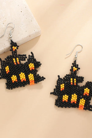 Beaded Castle earrings in black with orange and yellow accents.