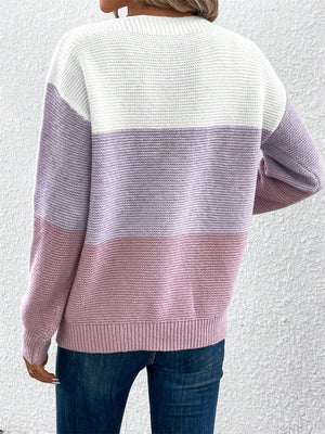 Colorblock boatneck knit sweater with horizontal stripes in white, lavender, and pink.