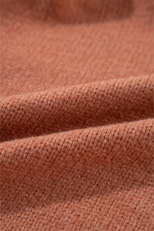 Open-front cropped knit cardigan in burnt coral acrylic with a ribbed texture.