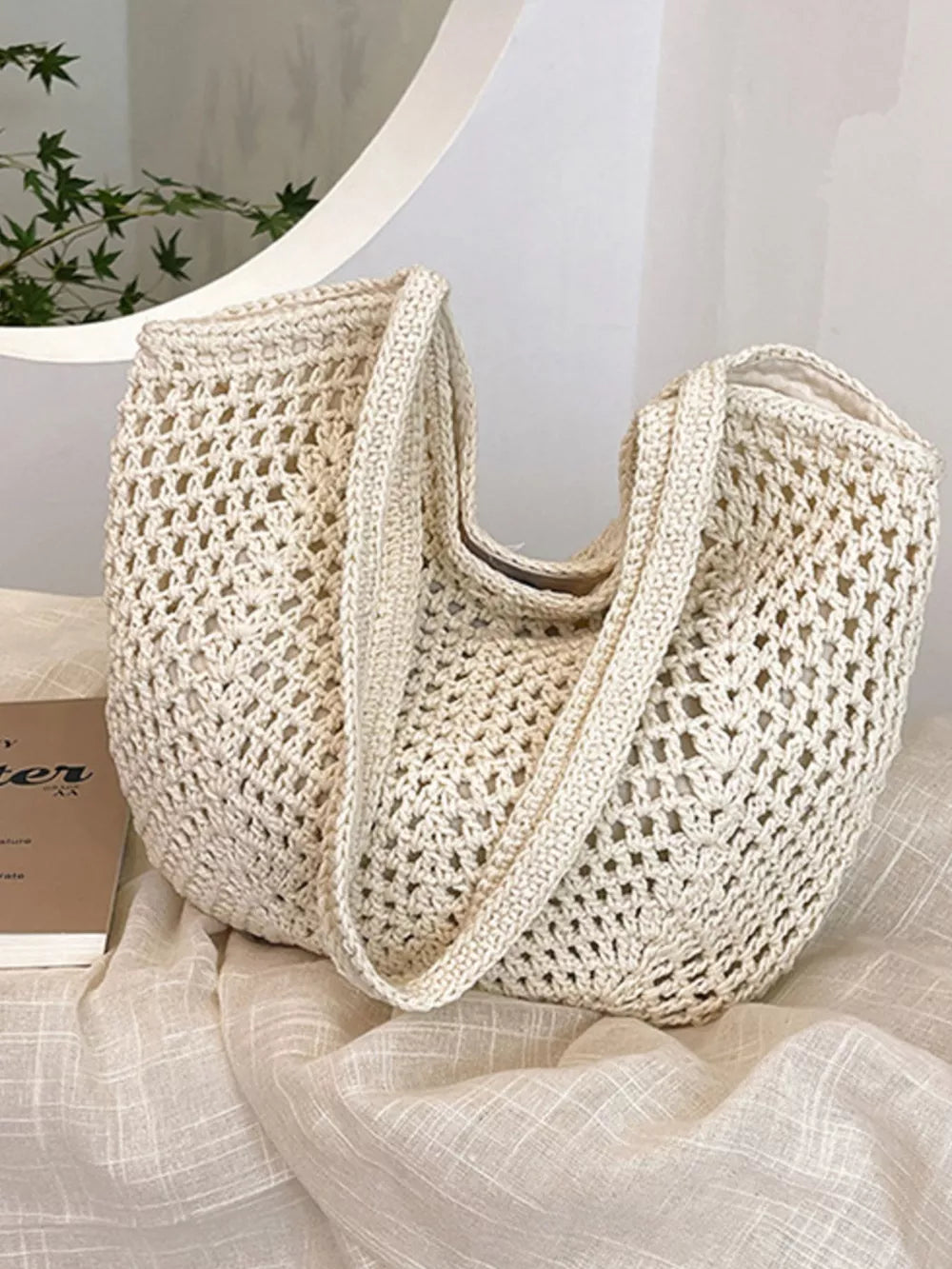 Chevron woven straw shoulder bag in Rice White with braided straps and open crochet detail.