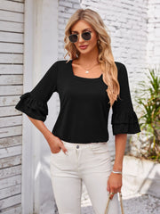 Black blouse with square neckline and ruffled sleeves