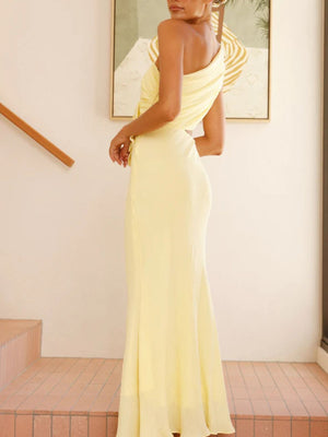 Yellow one-shoulder maxi dress with floral appliqué and cutout detail.
