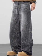 Refined wide-leg jeans in Black Gray with geometric panel detailing and a relaxed fit.