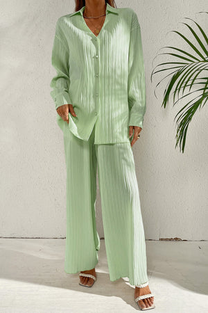 Pastel blue pleated co-ord set with button-down shirt and wide leg trousers