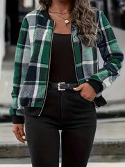 Plaid bomber jacket in dark green with ribbed cuffs and a zip front, worn over a black top.