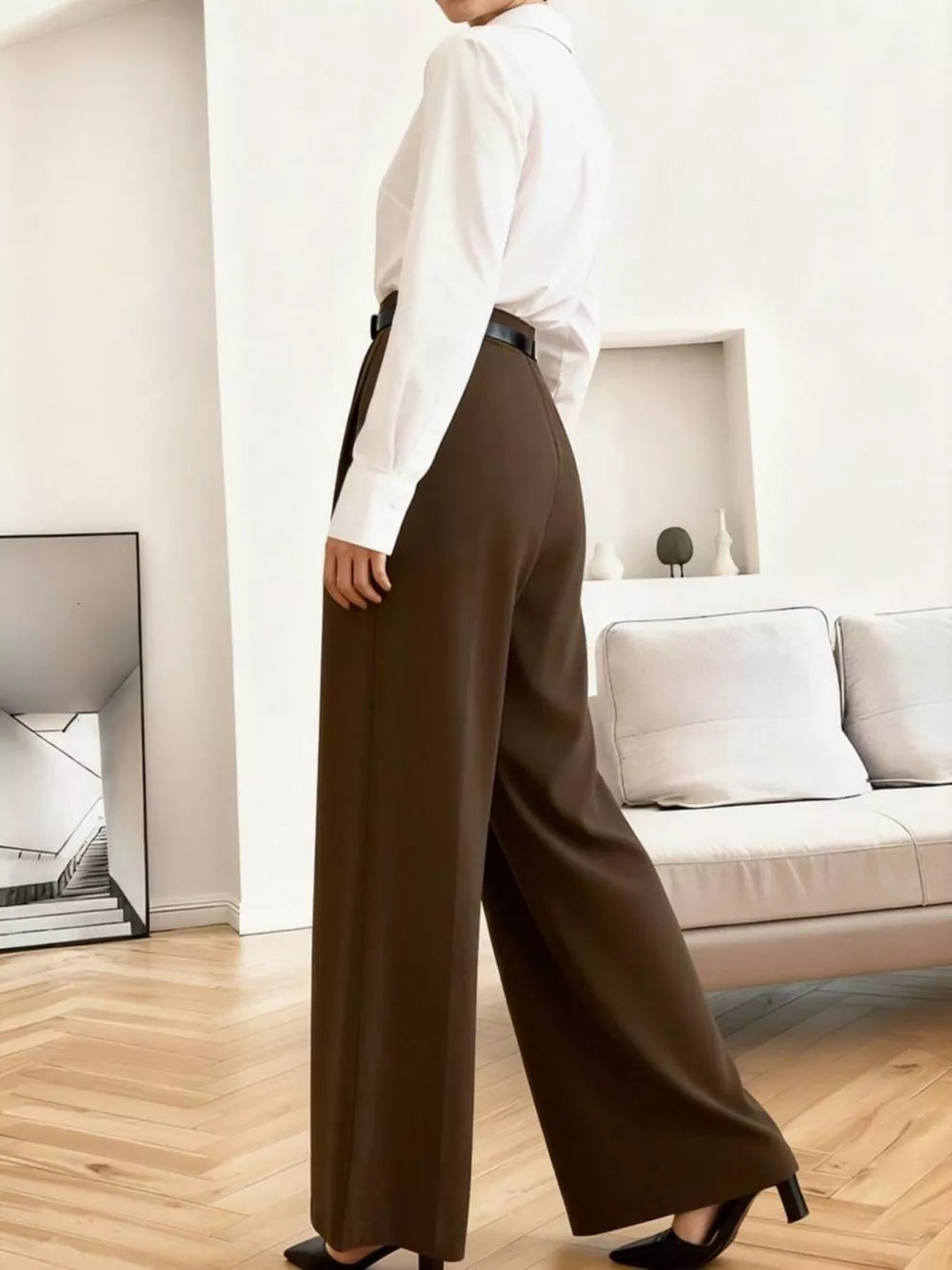 High-waisted brown pleated wide leg maternity trousers with a relaxed fit.