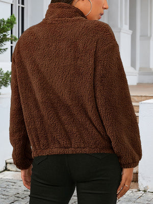 Brown sherpa bomber jacket with a high neck and elastic cuffs.