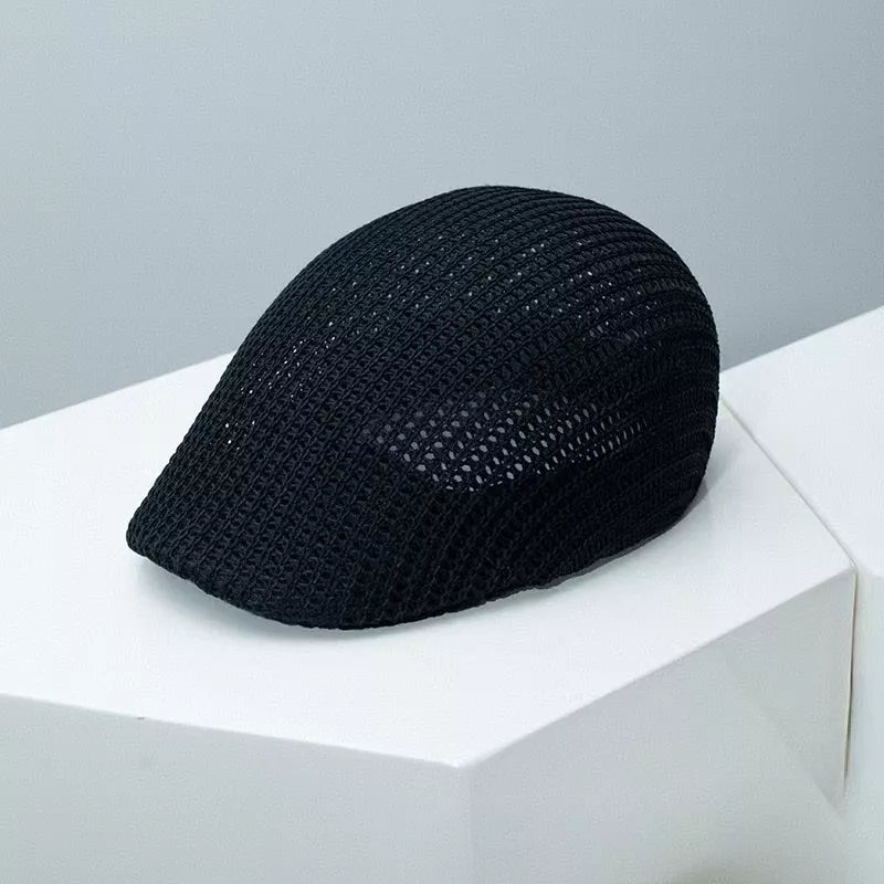Black mesh flat cap with textured weave detail
