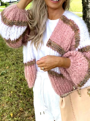 Chic color block open cardigan with balloon sleeves in pink and white acrylic, featuring gold trim.