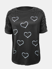 Black t-shirt with white heart print and lace trim on shoulders and sleeves.