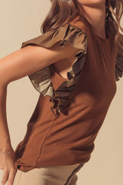 Brown ribbed top with faux leather ruffled sleeves and lace-up detail