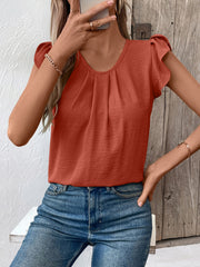 Terracotta pleated yoke flutter sleeve blouse with a scoop neck.