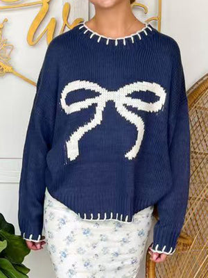 Navy knit sweater with white bow graphic and contrast stitching details.