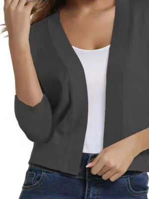 Charcoal cropped open-front knit cardigan with elbow-length sleeves and ribbed cuffs.