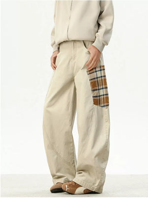 Men's wide-leg sweatpants in apricot with a plaid patchwork detail.
