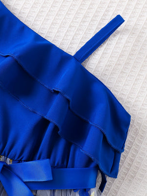 Royal blue asymmetrical ruffled toddler dress with embroidery detail and sash.