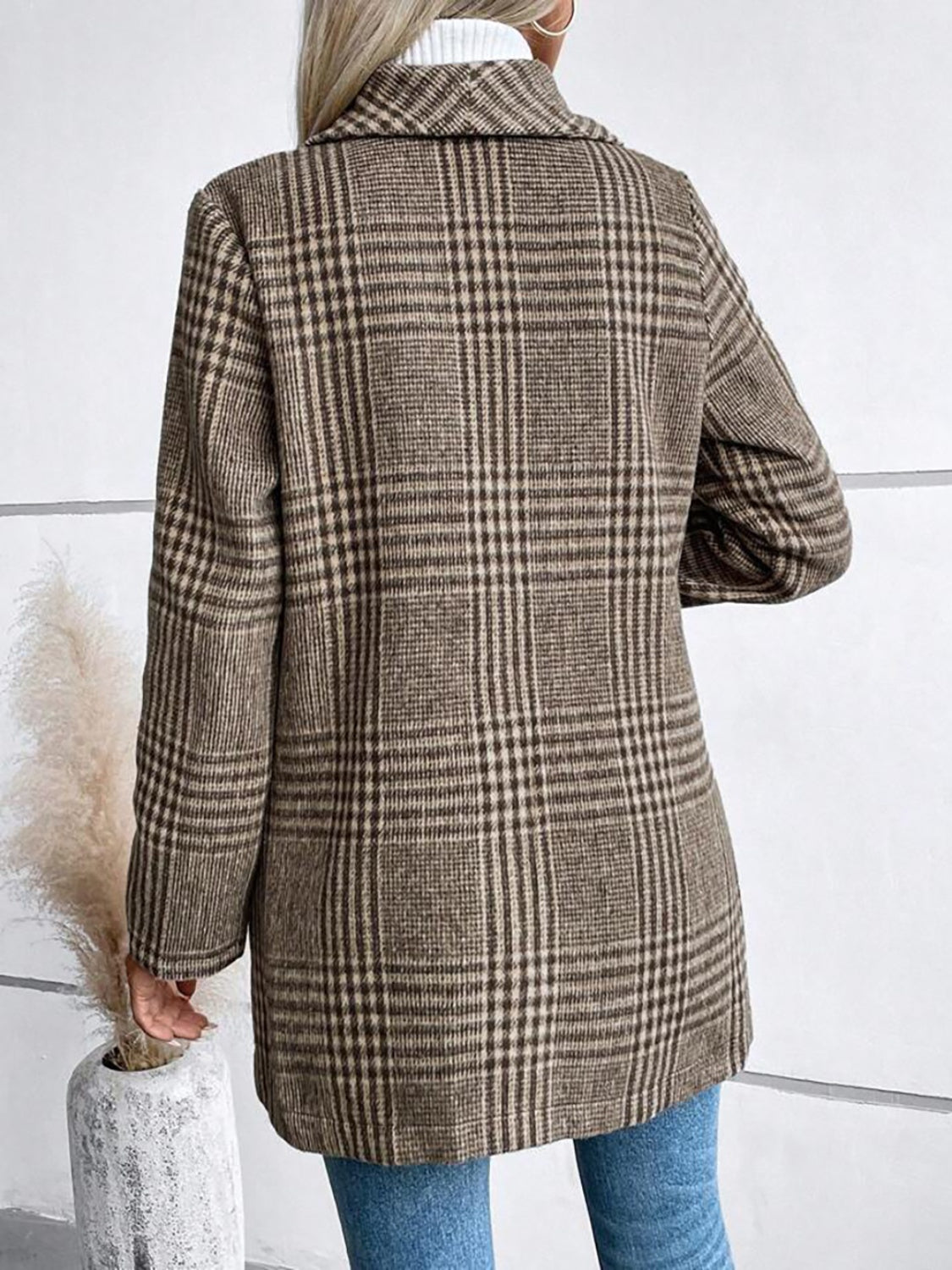 Coffee brown plaid tailored overcoat with a single button closure and notched lapel.
