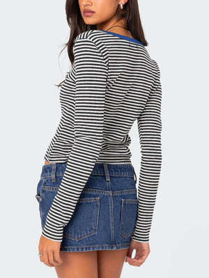 Striped long sleeve henley with contrast blue collar and button detail.