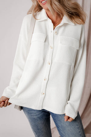 White textured corduroy overshirt with patch pockets and button front.