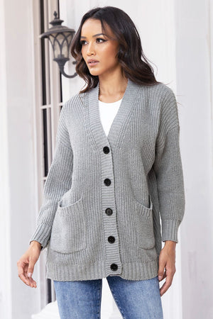 Dark gray ribbed knit oversized cardigan with buttons and pockets.