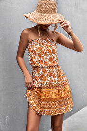 Floral print bandeau mini dress in caramel with a drawstring waist and ruffled hem.