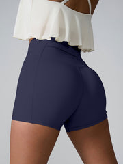 Navy active shorts with sculpted pocket detail and high waist