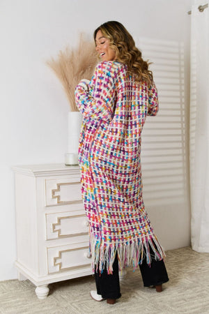 Multi crochet maxi cardigan with fringe detail and plaid pattern.
