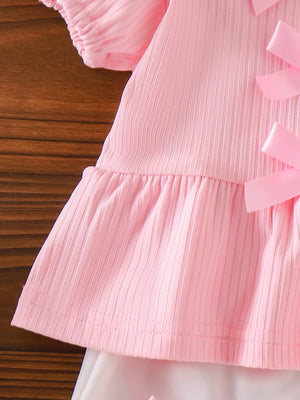 Children's Ribbed Bow Top And Shorts Set in Pink, model styling view