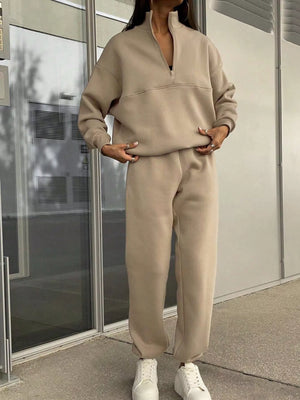 Tan half zip sweatshirt and matching jogger pants set.