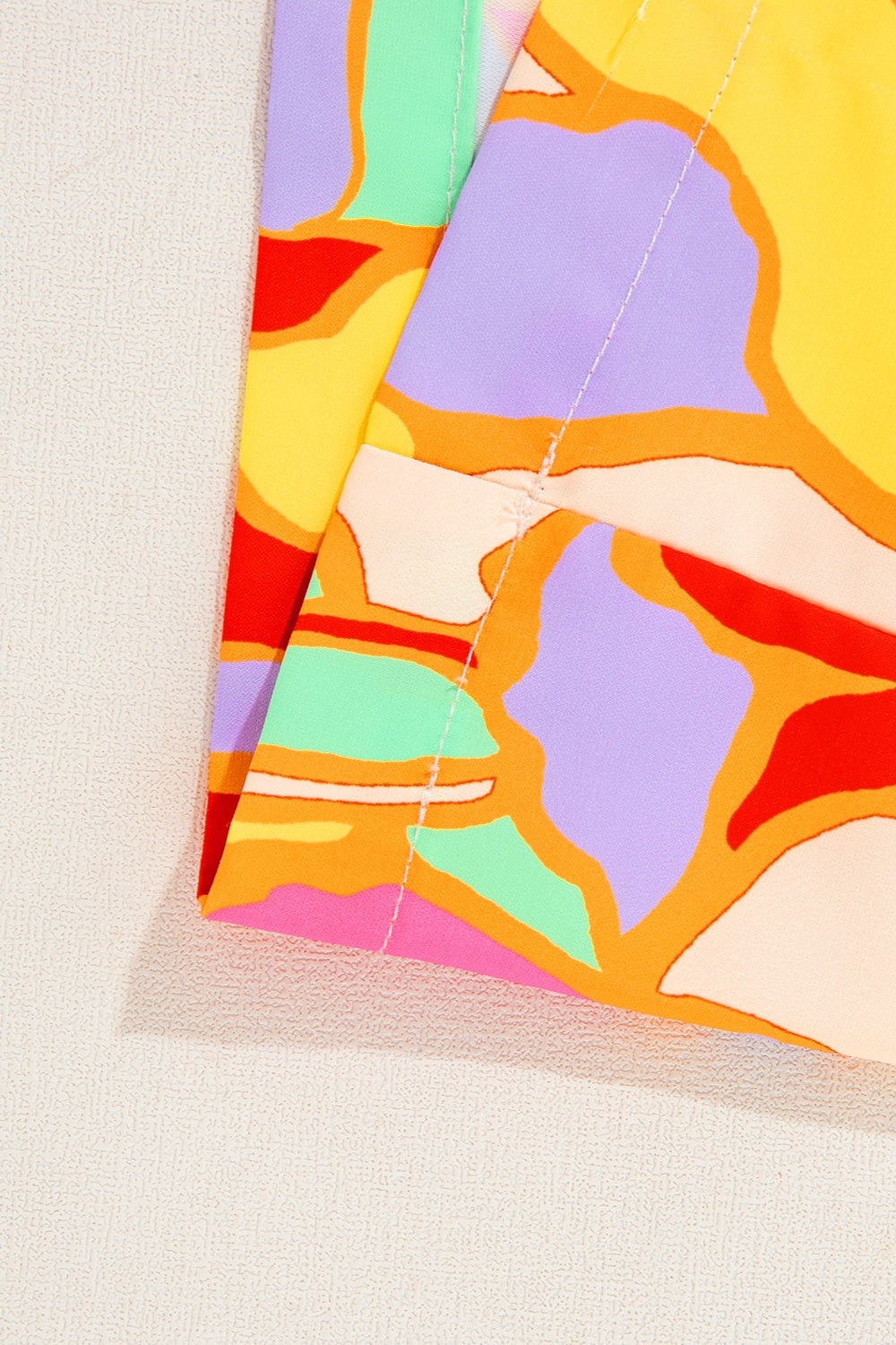 Psychedelic print polyester blouse with gathered yoke detail.