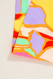 Psychedelic print polyester blouse with gathered yoke detail.