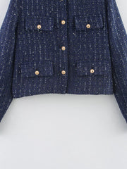 Dark blue cropped tweed button-up jacket with gold buttons and chest pockets.