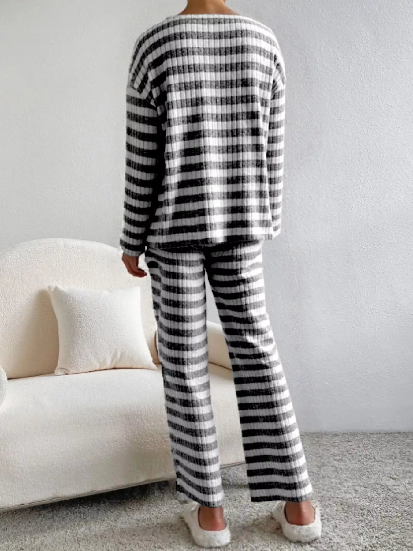 Black striped knit loungewear set with long sleeves and pants.