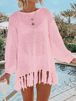 Blush pink open-knit acrylic beach cover-up with fringe hem and crew neck.