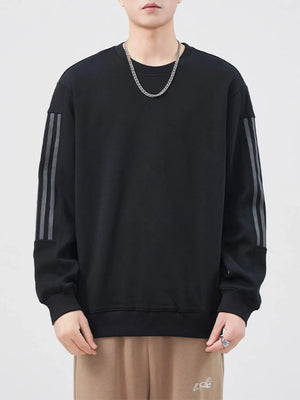 Black crewneck sweatshirt with grey striped sleeves and ribbed cuffs and hem