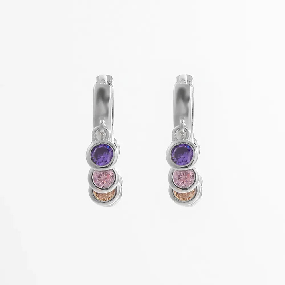 Silver dangle hoop earrings with purple, pink, and peach cubic zirconia stones.