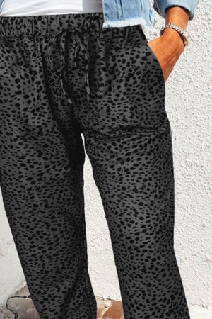 Shadow Leopard Relaxed-Fit Drawstring Trousers in Charcoal with pockets and adjustable tie waist.