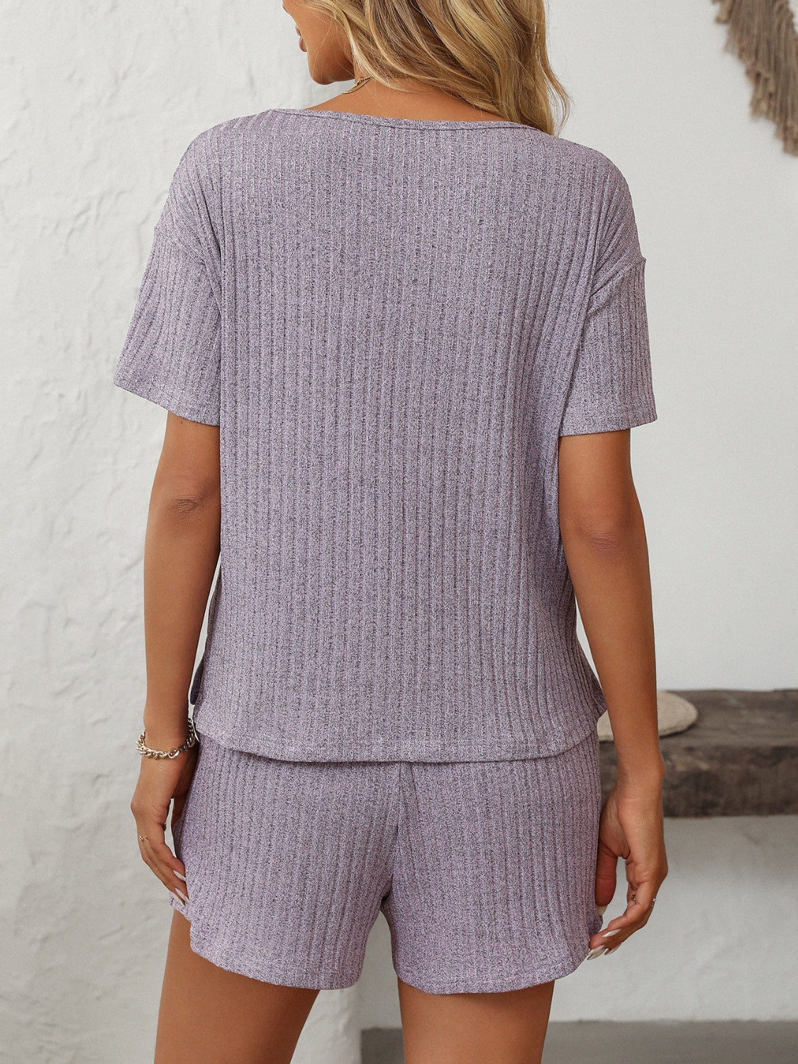 Lilac ribbed V-neck loungewear set with short sleeves and matching shorts.
