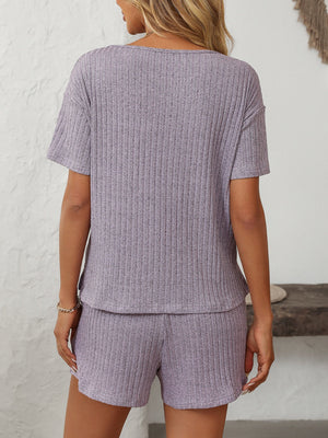 Lilac ribbed V-neck loungewear set with short sleeves and matching shorts.