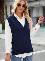 Dark Blue ribbed knit V-neck sweater vest with a relaxed fit, styled over a white shirt.