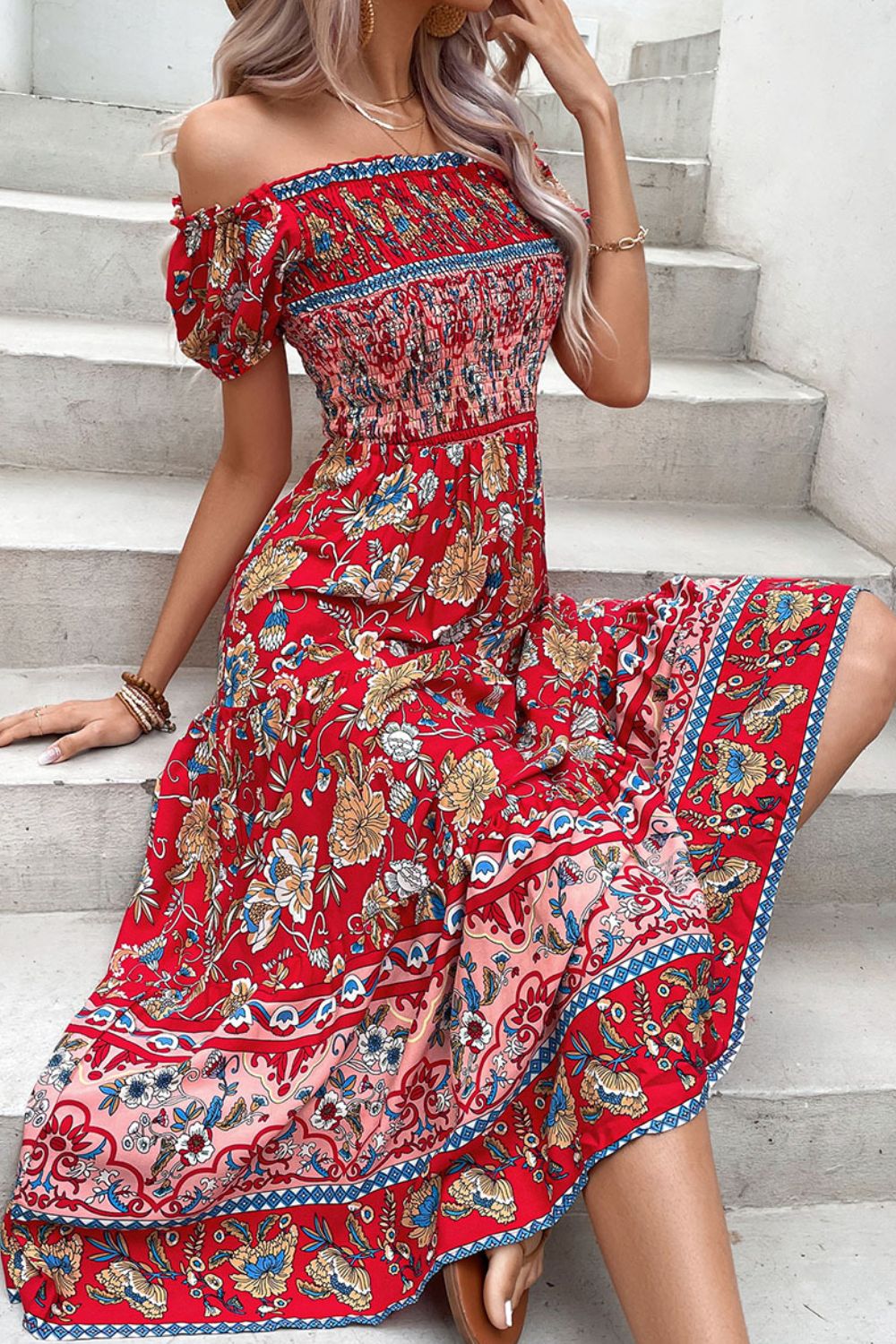 Red floral off-shoulder dress with smocked bodice and tiered skirt.